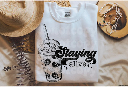 STAYING ALIVE COFFEE TEE WITH SKULLS